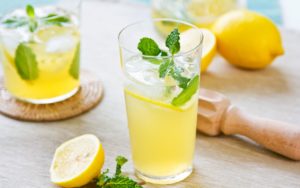 lemon-juice-lemonade-mint-drink-glass-mojito-ice-background