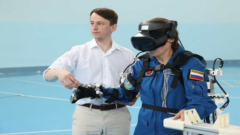 Russian astronauts test a virtual reality helmet on the International Space Station